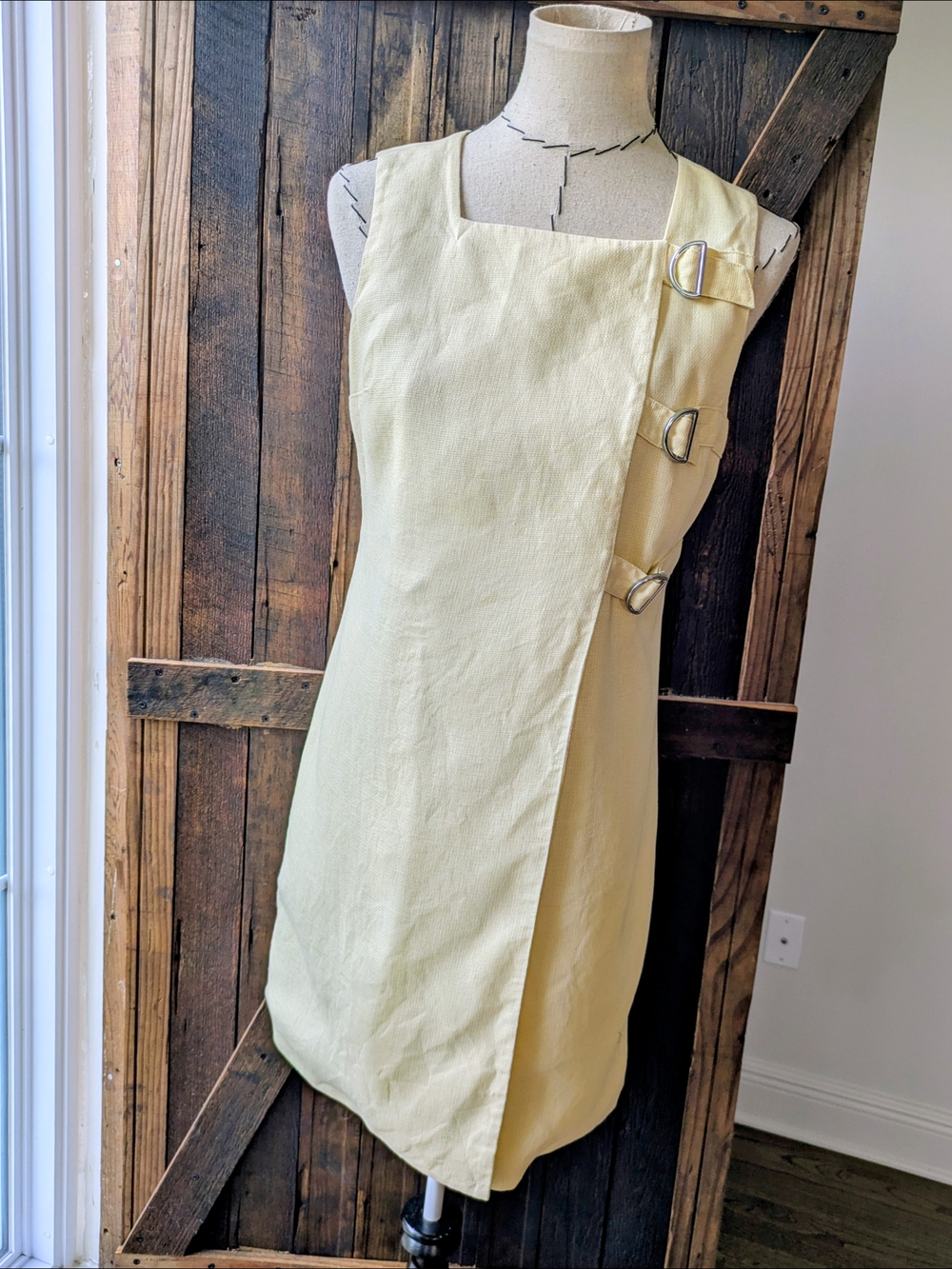 Pale Yellow Sleeveless Mini Dress with Side Buckle Detail